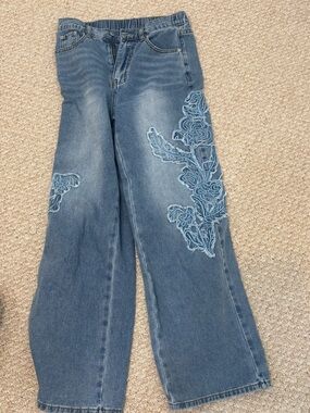 Women's Blue Denim Jeans with Floral Embroidery. Size small